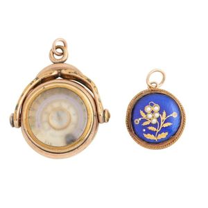 Two Antique Pendants Including One Spinner Set With Carnelian