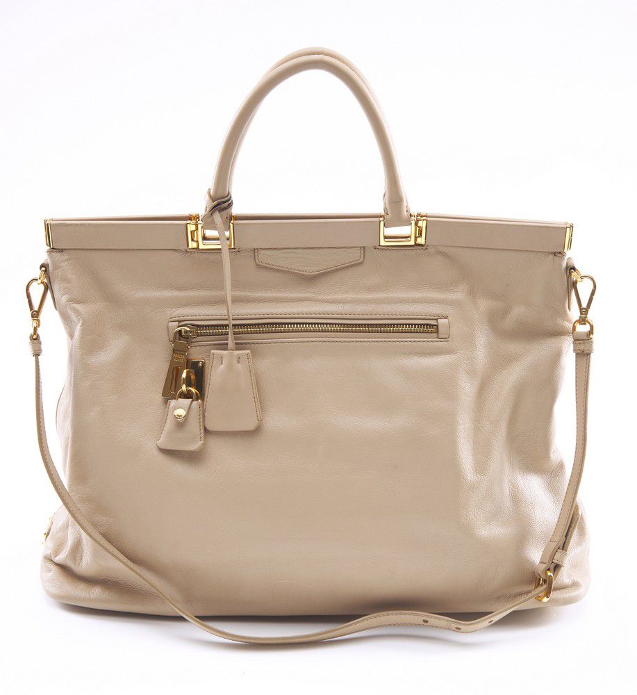 A handbag by Prada, styled in beige leather with gold metal… - Handbags ...
