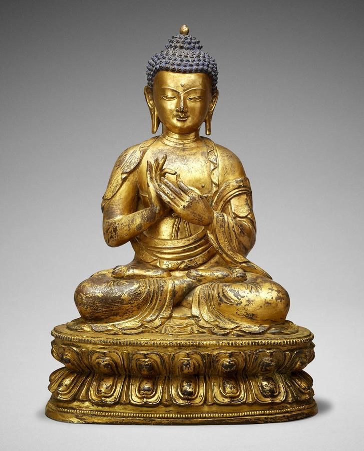 A large gilt bronze figure of Buddha , TIBET, 15TH CENTURY 