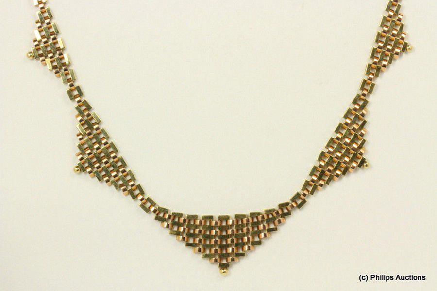 A fancy gold necklace, 14ct yellow gold, made as a series of ...