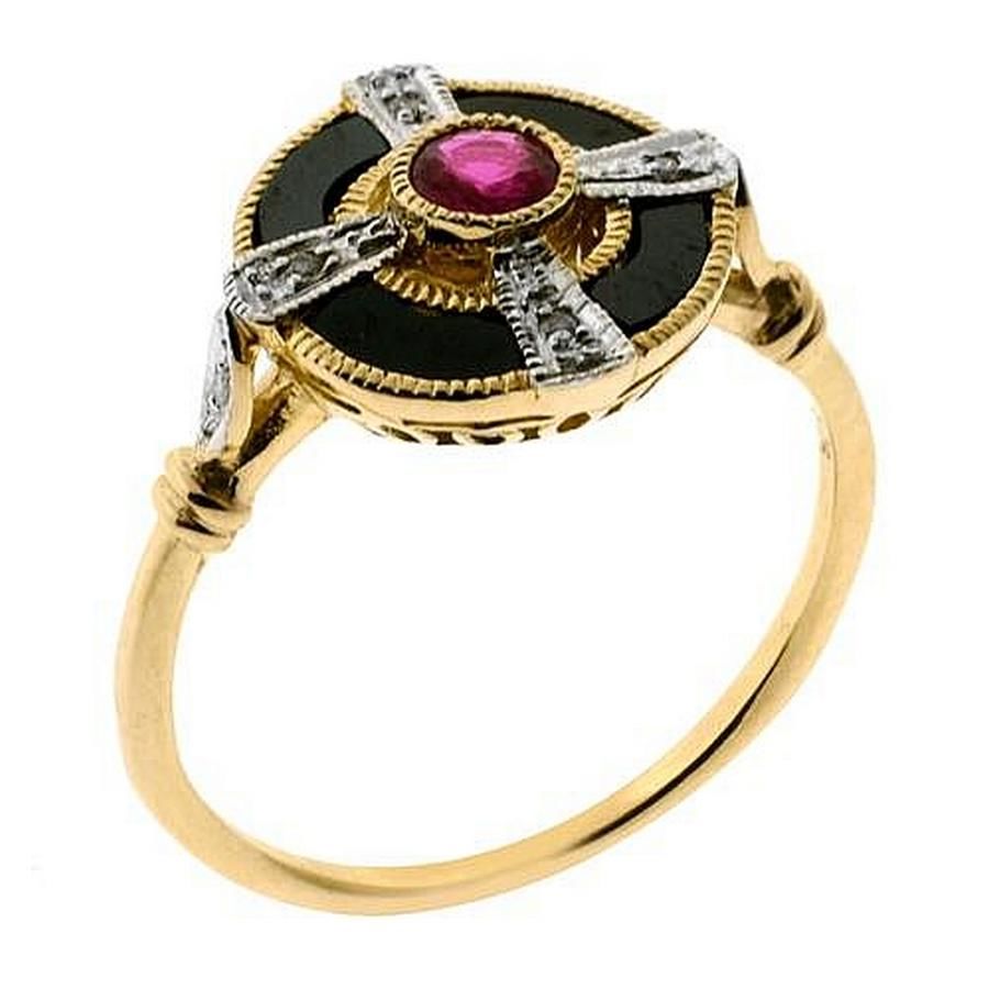 An Art Deco style gem set target ring; centring a ruby