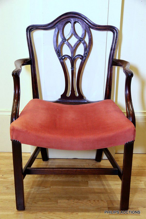 A Georgian mahogany elbow chair, a channel grooved square back