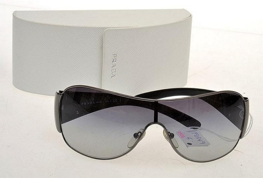 A pair of sunglasses by Prada, styled with a single lens inâ¦ - Sunglasses - Costume & Dressing 