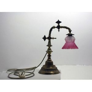 A 19th century brass wall applique. Presently a bedside lamp,…