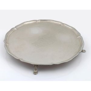 A sterling silver salver with engraved dedication, made in…