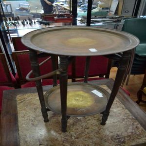 Antique Islamic engraved brass trays on folding stand with…
