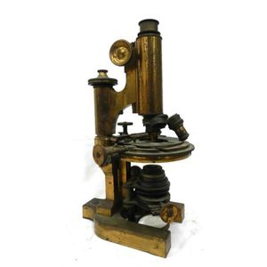 A vintage brass & metal microscope. Provenance: The country…
