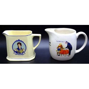 Two Wade scotch whisky advertising jugs both decorated with…