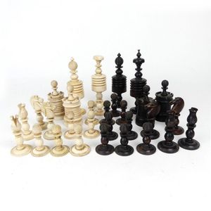 A Staunton pattern chess set, variously in bone and simulated…