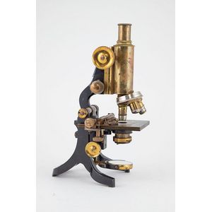 Late 19th century microscope, cased, brass and japanned with…