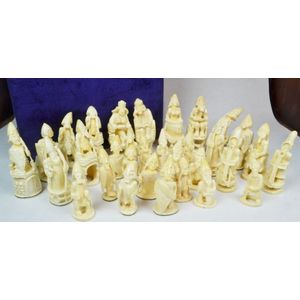 Chess pieces: 32 red and white ivory pieces without board., Complete number  of pieces of a chess game. Sixteen cut ivory pieces that have been made red  with a dyestuff: these are