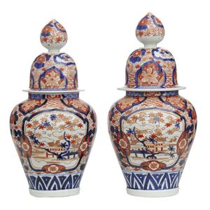 A pair of Imari style or Arita ware lidded baluster vases, with…