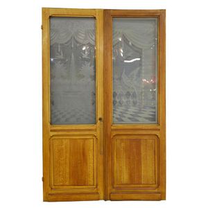 Two similar Flemish doors in simulated oak, circa 1890, each…