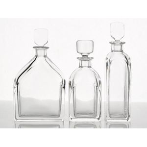 Orrefors, three clear crystal decanters with stoppers, etched…