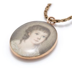 A Georgian gold framed miniature portrait hair locket, hand…