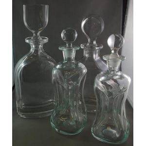 Four art glass decanters, to include two Orrefors, and two…