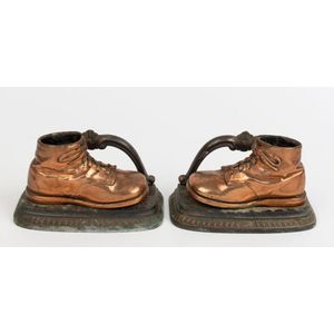 A pair of novelty boot bookends, cast copper and metal, 20th…