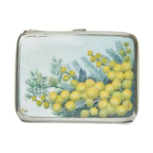 A sterling silver cigarette case decorated with a flowering…