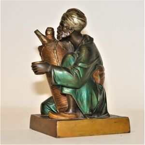 An Orientalist Art Deco cold painted bronze figure of an Arab…