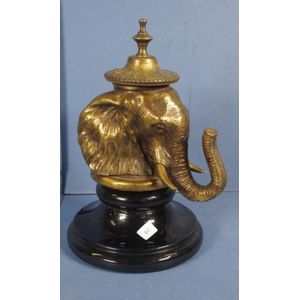 Brass elephant head inkwell, on black English ceramic base,…