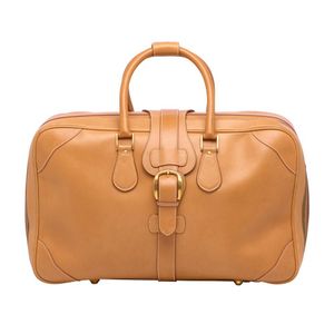 A vintage zip around travel suitcase by Gucci, styled in beige…
