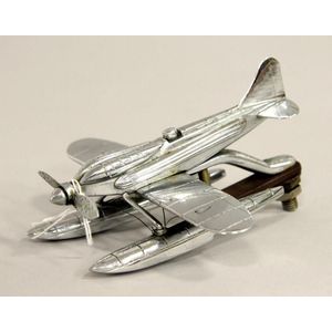 A vintage chrome seaplane hood ornament with small faults.…