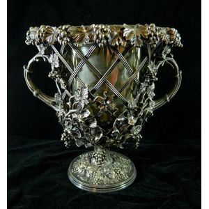 A silver-plate open lattice-form ice bucket with applied grape…