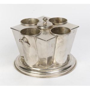 A silver plated 4 bottle wine cooler. 24 cm high, 32 cm wide,…