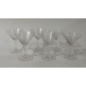 A collection of Art Deco cocktail glasses with etched detail,…