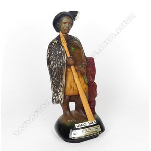 A Jim Beam 'Hongi Hika' decanter, with music box base. Repaired…