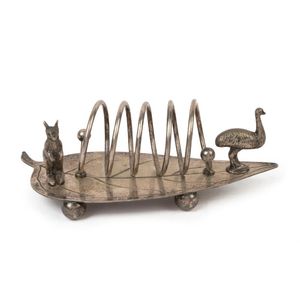 An Australian silver plated toast rack of gum leaf form adorned…