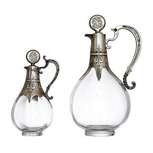 A graduated pair of Art Deco French silver mounted bottles by…