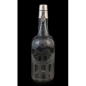 An antique decanter with fine wheel-cut decoration and silver…