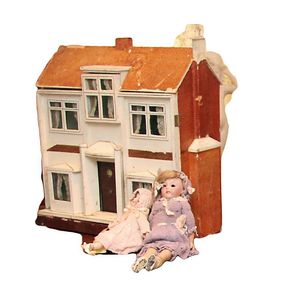 An early 20th century doll's house with a Georgian style facade,…