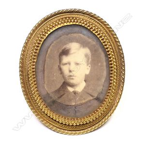 A Victorian 9ct gold, oval portrait miniature frame, rope and…