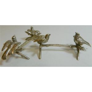 A pair of silver plated knife rests in the form of birds on…