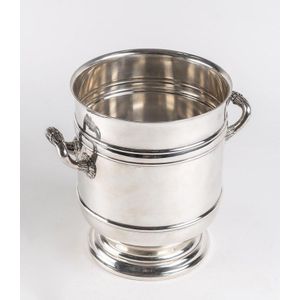 A silver plated circular twin handled wine cooler by Christofle,…
