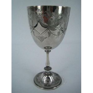 A Victorian silver-plate trophy of goblet form, engraved, on…