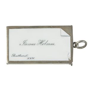 A sterling silver and enamel vesta case, the front white enamel…