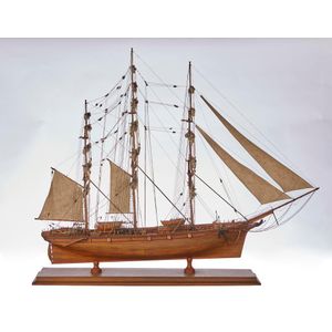 A wooden scale model of the clipper ship 'Cutty Sark', on a…