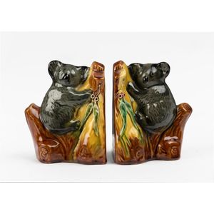 A pair of Florenz pottery bookends, circa 1940, each modelled…