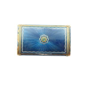 A gold and enamel cigarette case by Cartier, the rectangular…