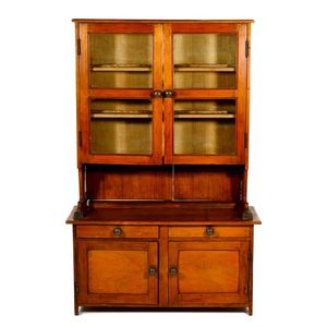 Child's miniature kitchen dresser with glass doors enclosing…