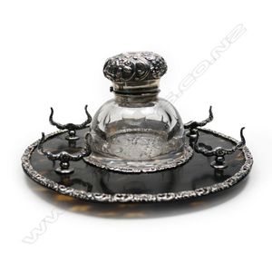 A late Victorian silver and tortoiseshell standish, the…