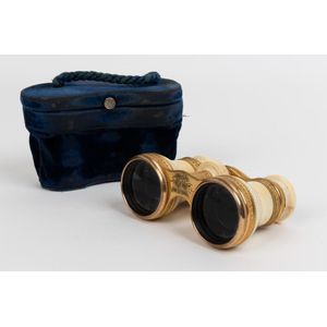 A set of brass mounted ivory opera glasses, 19th century, in a…