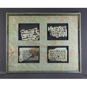 Four Kufic Koran fragments, mounted in double sided frame. 10 x…