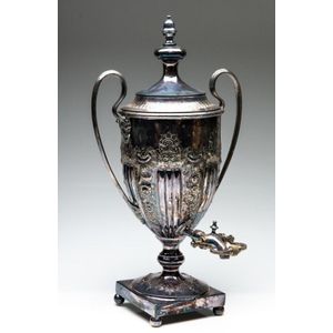 An ornate silverplated twin handled samovar on ball feet,…