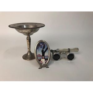 A collection of decorative silver plate objets, comprising a…