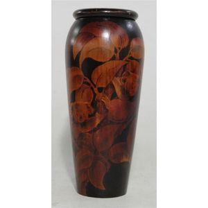 An Australian pokerwork timber vase, with koala design. Height…