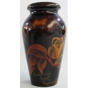 An Australian pokerwork timber vase, with koala 'Greetings from…